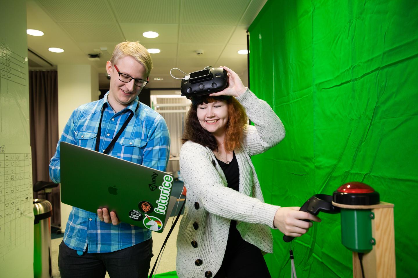 Two people working with VR glasses