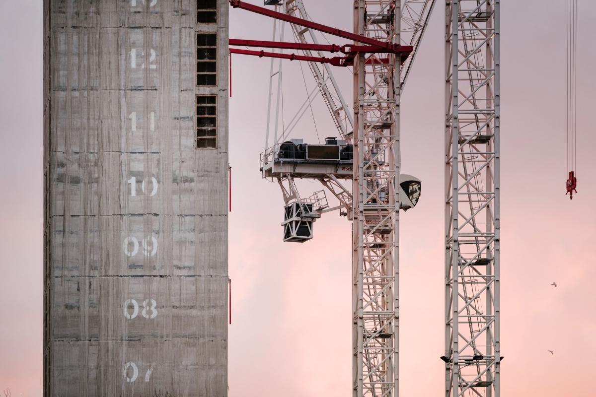 tower construction in progress with cranes 