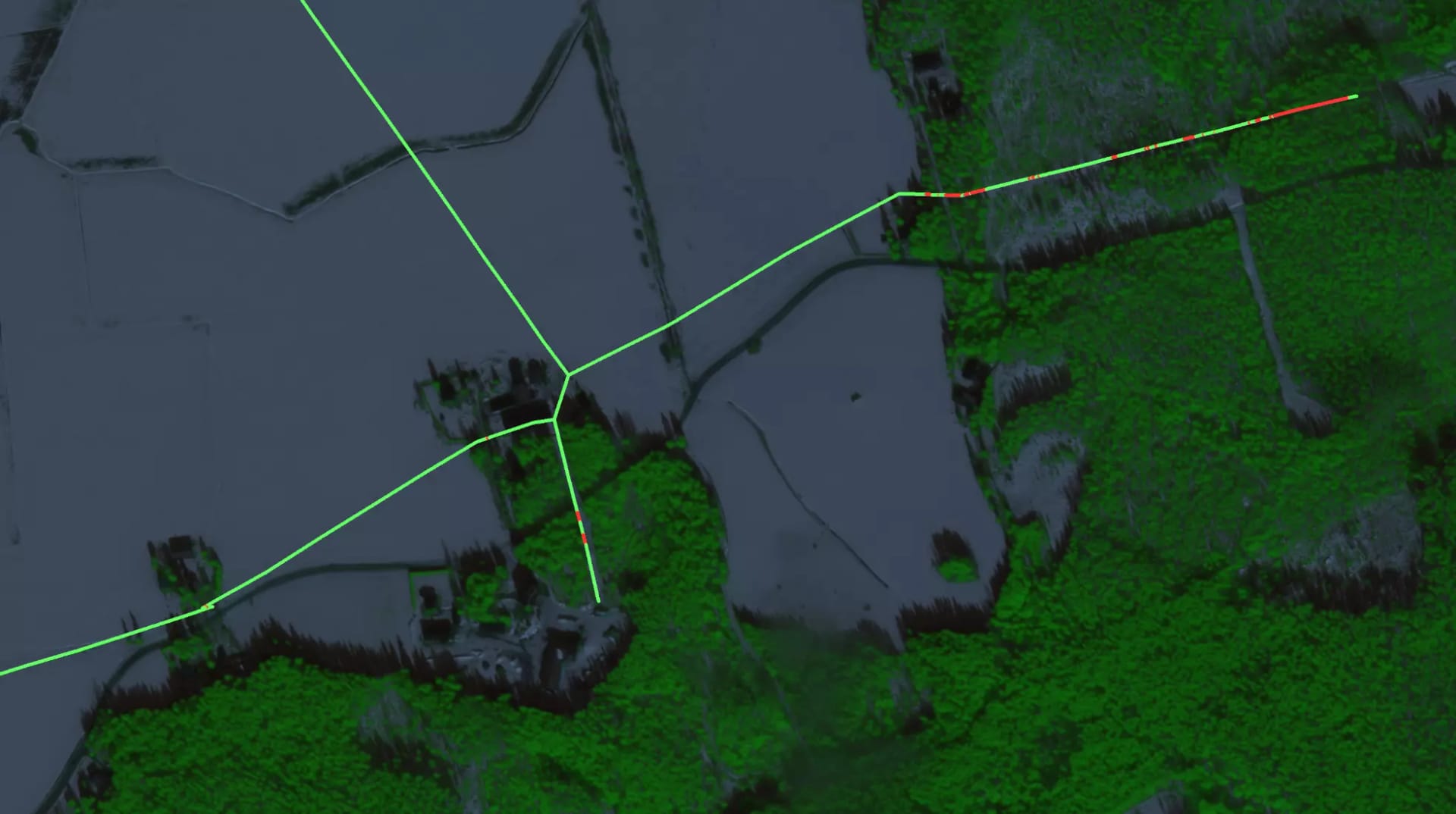 Aerial map view showing green vegetation areas and blue-grey water bodies with bright green navigation lines overlaid.